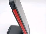 a cell phone that is sitting on top of a stand
