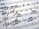 an old sheet of music with handwritten notes on it