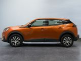 the orange toyota c - hr suv is parked in a garage