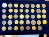 a box with a lot of different coins in it