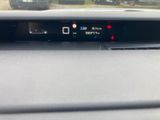 a car dashboard with a digital display on it
