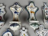 a lot of ceramic figurines that are on the table