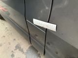 a close up of a car door with a sticker on it