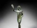 an image of a statue of a woman holding a tennis racquet