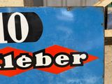 a blue sign with a red and black number on it