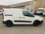 a picture of a white van parked in a parking lot