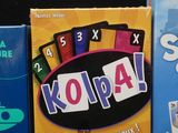 three boxes of games sitting on a black surface