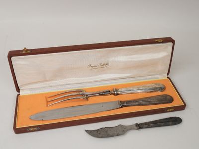 a knife, fork and knife holder in a box