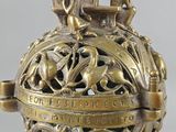 an image of a golden vase with a statue on top of it