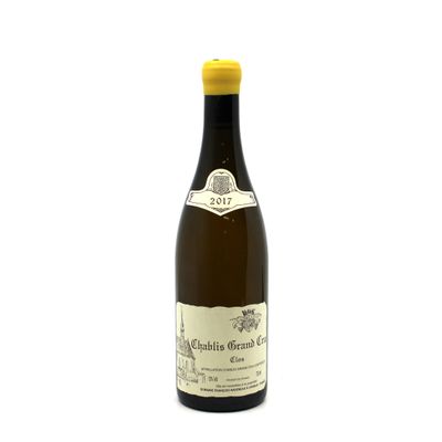 a bottle of wine that is sitting on a white surface