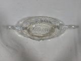 a glass bowl with water inside of it on a white surface