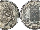 une pièce d'argent surmontée d'une couronne