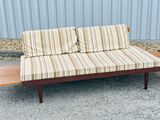 a couch that is sitting on a wooden table