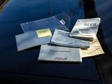 a lot of papers on the hood of a car