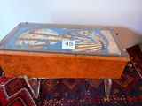 a table with a glass top that has a picture on it
