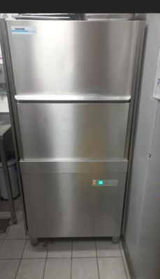 a stainless steel refrigerator in a kitchen with tile flooring