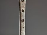 a silver spoon with a spoon handle on it