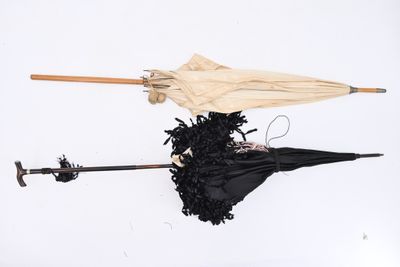 two umbrellas that have been left on the ground