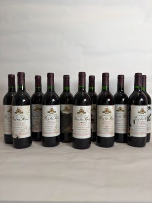 six bottles of wine are lined up on a table