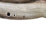 a close up of a wooden shoe with holes in it