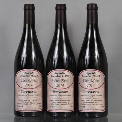 three bottles of wine sitting on top of a table next to each other