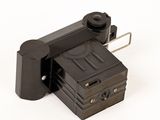 a small camera that is sitting on a white surface