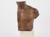 sculpture of a man ' s head on a marble base