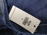 the back of a pair of jeans with a price tag on it