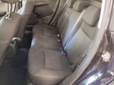 the back seats of a car are empty and the seats are empty