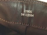 the bottom of a pair of brown leather shoes with a brown sole
