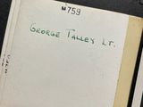 a person holding a book with a handwritten title on it