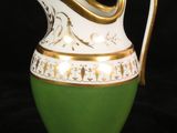 an image of a green and white pitcher on a black background
