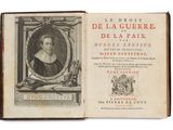 an old book with a picture of a woman in a frame