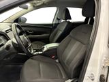 the interior of a car with the door open and the driver ' s seat down