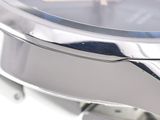 a close up of a watch on a white surface