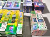 a lot of cigarettes sitting on a table next to each other