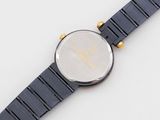 an image of a close up of a wrist watch on a white surface