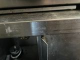 a close up view of an oven with a lot of burners on it