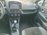 a dashboard of a small car with a clock on it