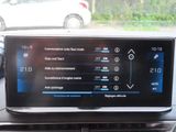 the dashboard of a car with a digital display on it
