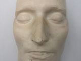 a close up of a sculpture of a man ' s face