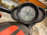 a close up of a motorcycle with a speedometer on it