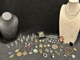 several different types of jewelry are displayed on a mannequin