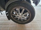 a close up of a motorcycle tire on a tiled floor