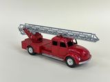 a red toy fire truck with a ladder on top of it