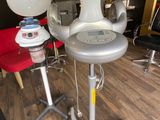 a hair dryer sitting on top of a table in a salon