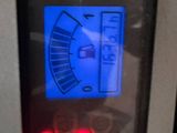a close up of a meter on the side of a machine