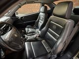 the interior of a car with black leather seats and a steering wheel