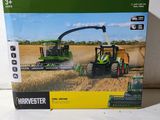a box with a picture of a tractor and a combiner in it