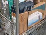a shopping cart full of boxes and papers in a store